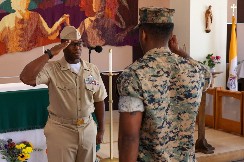 U.S. Navy Lt. j.g. Jimi Liddell Gayden, left, a newly commissioned Naval officer with 3rd Marine Aircraft Wing, returns his first salute as an officer from Sgt. Santiago Desmond, an intelligence chief with 3rd Marine Aircraft Wing, during his commissioning ceremony at Marine Corps Base Camp Pendleton, California, July 30, 2024. Following 28 years of service in the U.S. Marine Corps, on July 30, 2024, Liddell Gayden commissioned as a lieutenant junior grade in the U.S. Navy to pursue a new career as a chaplain. Liddell Gayden will attend Navy Officer Development School this fall, followed by Naval Chaplaincy School.  (U.S. Marine Corps photo by Cpl. Nicholas Johnson)
