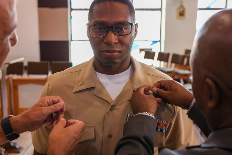 U.S. Marine Corps Master Gunnery Sgt. Jimi Liddell Gayden, an intelligence chief with 3rd Marine Air Wing, is pinned to the rank of lieutenant junior grade during his commissioning ceremony at Marine Corps Base Camp Pendleton, California, July 30, 2024. Following 28 years of service in the U.S. Marine Corps, Liddell Gayden commissioned as a lieutenant junior grade in the U.S. Navy to pursue a new career as a chaplain. Liddell Gayden will attend Navy Officer Development School this fall, followed by Naval Chaplaincy School.  (U.S. Marine Corps photo by Cpl. Nicholas Johnson)