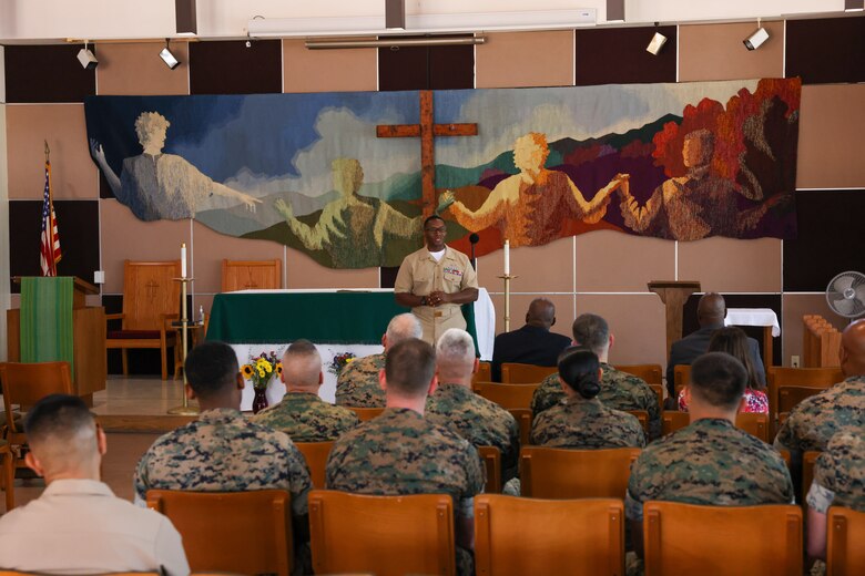 U.S. Marine Corps Master Gunnery Sgt. Jimi Liddell Gayden, an intelligence chief with, 3rd Marine Aircraft Wing, gives opening remarks during his commissioning ceremony at Marine Corps Base Camp Pendleton, California, July 30, 2024. Following 28 years of service in the U.S. Marine Corps, Liddell Gayden commissioned as a lieutenant junior grade in the U.S. Navy to pursue a new career as a chaplain. Liddell Gayden will attend Navy Officer Development School this fall, followed by Naval Chaplaincy School. (U.S. Marine Corps photo by Cpl. Nicholas Johnson)