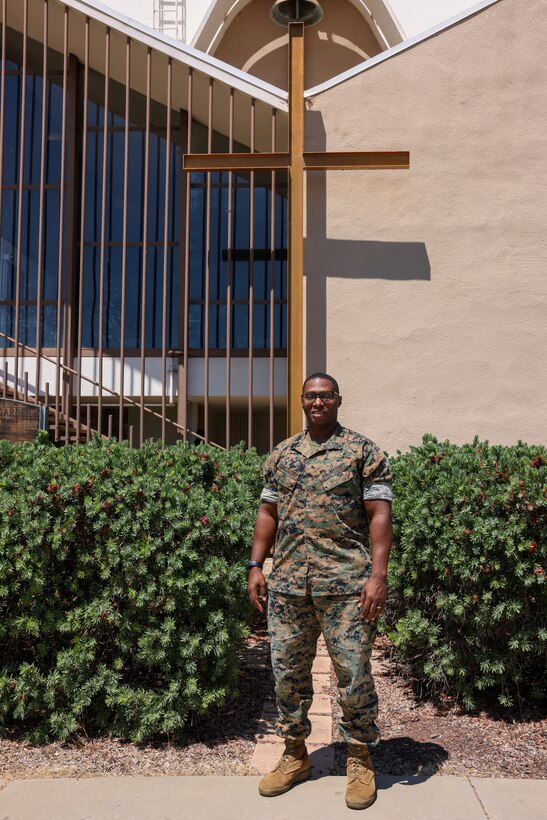 U.S. Marine Corps Master Gunnery Sgt. Jimi Liddell Gayden, an intelligence chief with 3rd Marine Aircraft Wing, poses outside of the Base Chapel at Marine Corps Air Station Miramar, California, July 29, 2024. Following 28 years of service in the U.S. Marine Corps, on July 30, 2024, Liddell Gayden commissioned as a lieutenant junior grade in the U.S. Navy to pursue a new career as a chaplain. Liddell Gayden will attend Navy Officer Development School this fall, followed by Naval Chaplaincy School. (U.S. Marine Corps photo by Cpl. Nicholas Johnson)
