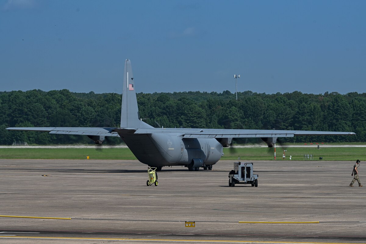 A plane sits on a runway.