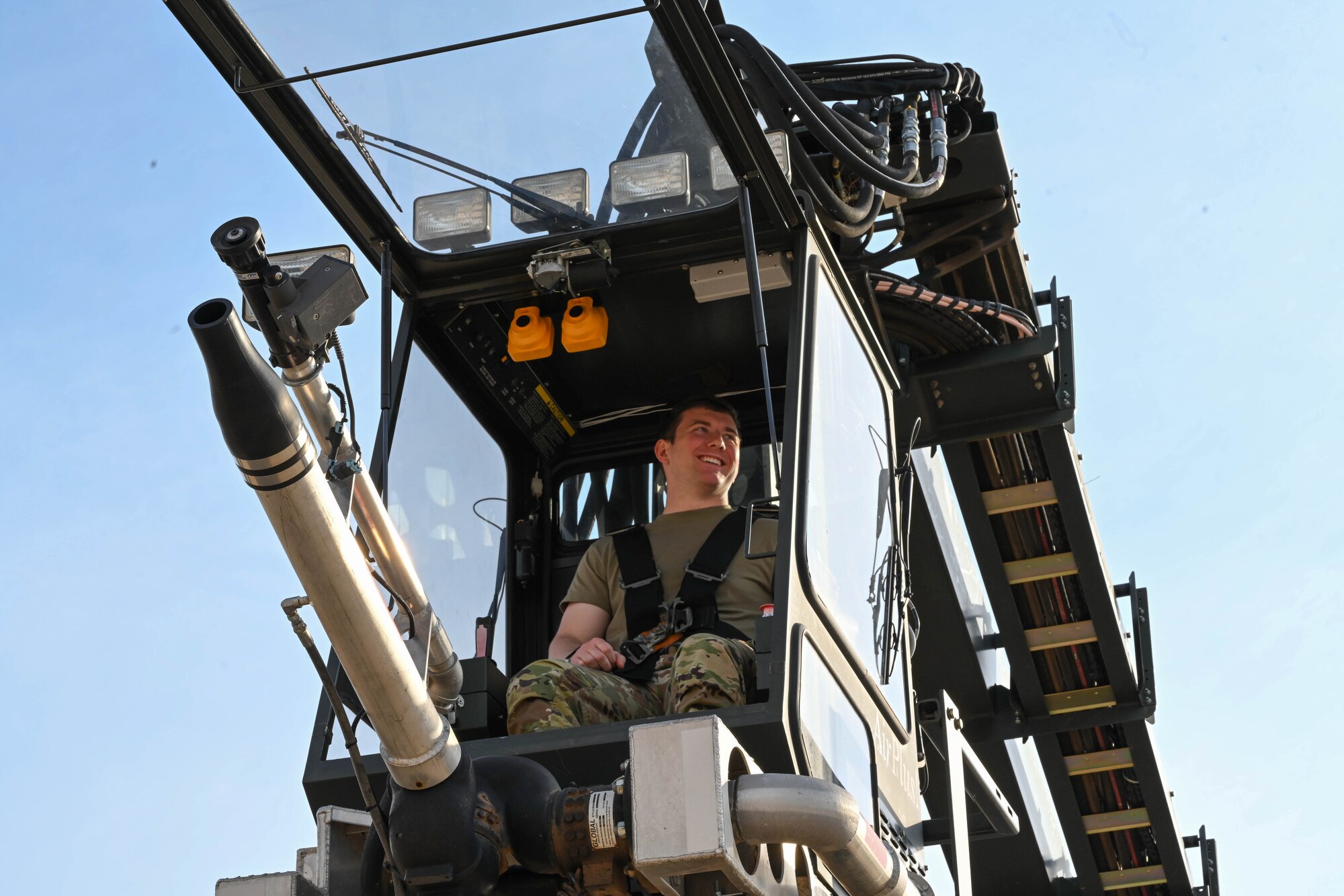 Jonah Raevel, U.S. Air Force Academy Cadet, operates an extended reach deicer during a tour of the 97th Logistics Readiness Squadron at Altus Air Force Base, Oklahoma, June 7, 2024. The cadets were able to participate in hands-on activities throughout the tour. (U.S. Air Force photo by Senior Airman Miyah Gray)