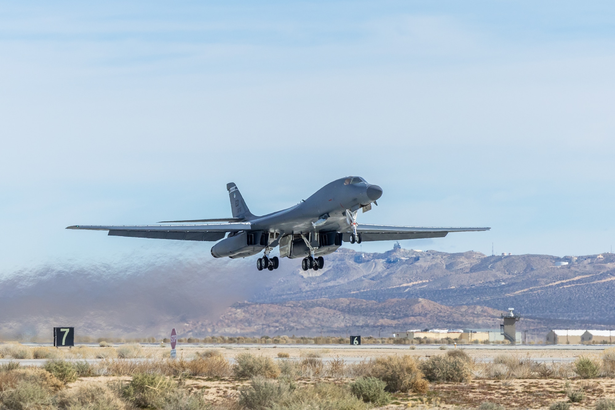 A B-1B Lancer assigned to the 419th Flight Test Squadron takes off from Edwards Air Force Base, California, Feb. 15, to conduct flight tests on the Load Adaptable Modular pylon. (Air Force photo by James West)