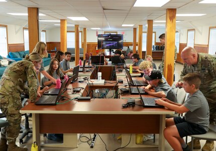 U.S. Soldiers with the Pennsylvania National Guard Cyber Branch host 13 students aged 11-18 from the Pequea Valley School District Apple Core Team for a day of learning and competition at Fort Indiantown Gap, Pennsylvania, Aug.1, 2024.