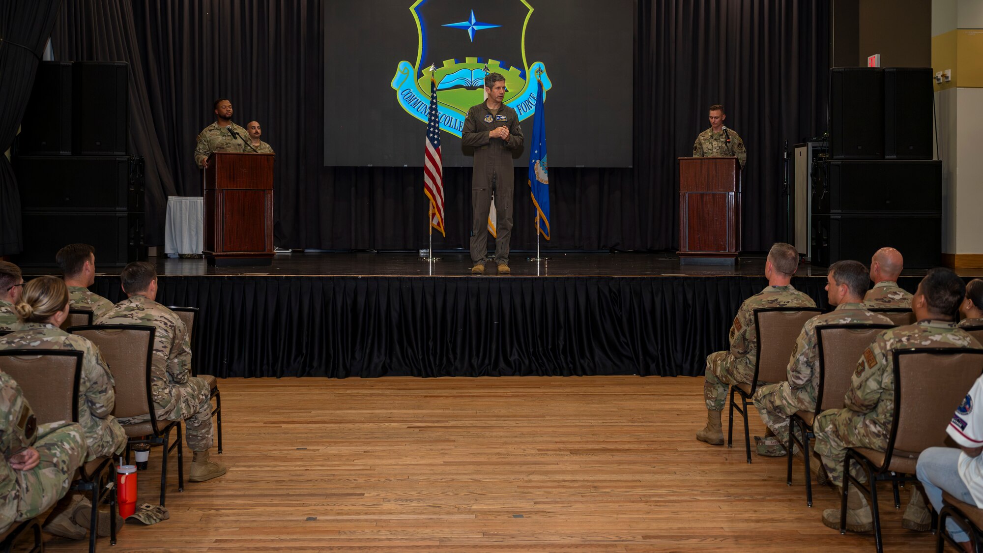 U.S. Air Force Col. William McKibban, 51st Fighter Wing commander, speaks to attendees after a Community College of the Air Force graduation ceremony at Osan Air Base, Republic of Korea, Aug. 2, 2024. The CCAF program improves the overall operational skills and ability of Airmen in their relevant career field, expanding on their job knowledge through courses such as leadership, mathematics and communication.  (U.S. Air Force photo by Senior Airman Sabrina Fuller-Judd)