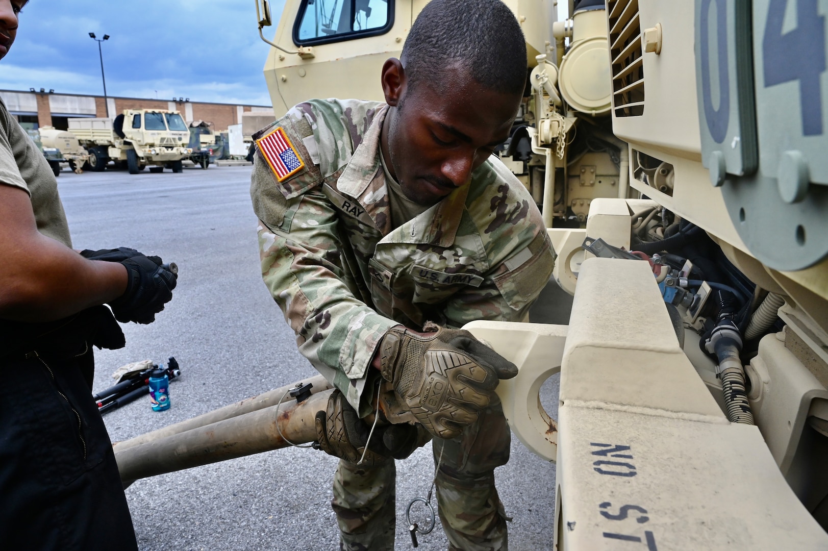 U.S. Army Pfc. James Ray, generator mechanic, 104th Maintenance Company, District of Columbia National Guard, installs a part on a tactical vehicle within the Combined Support Maintenance Shop at Joint Base Anacostia-Bolling (JBAB), June 5, 2024. A native of Washington, D.C, Pfc. Ray enlisted in the Army in 2022, motivated by the travel, connections and skills serving in the National Guard provides him.