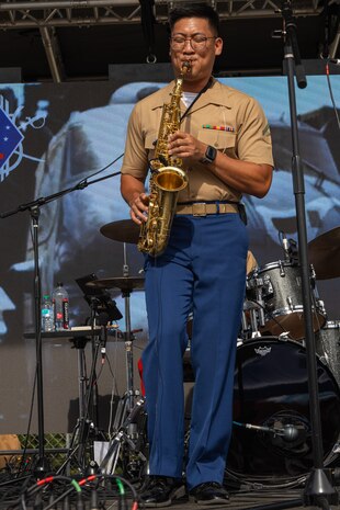 U.S. Marine Corps Lance Cpl. Derrick Atangan, a saxophonist with 1st Marine Division Band, gives a public performance as part of Seattle Seafair 2024 at Genesee Park in Seattle, Aug. 3, 2024. Seattle Seafair is the biggest summer celebration in the Pacific Northwest; spanning 10 weeks, featuring more than 40 events, and reaching more than two million people each year. (U.S. Marine Corps photo by Cpl. Bruin Largent)