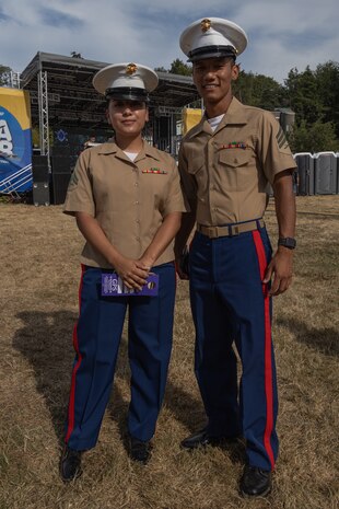 U.S. Marine Corps Cpl. Grecia Tierrafria, left, and Sgt. Kham Siam, both with Combat Logistics Battalion 23, pose for a photograph during Seattle Seafair 2024 at Genesee Park in Seattle, Aug. 3, 2024. Seattle Seafair is the biggest summer celebration in the Pacific Northwest; spanning 10 weeks, featuring more than 40 events, and reaching more than two million people each year. (U.S. Marine Corps photo by Cpl. Bruin Largent)