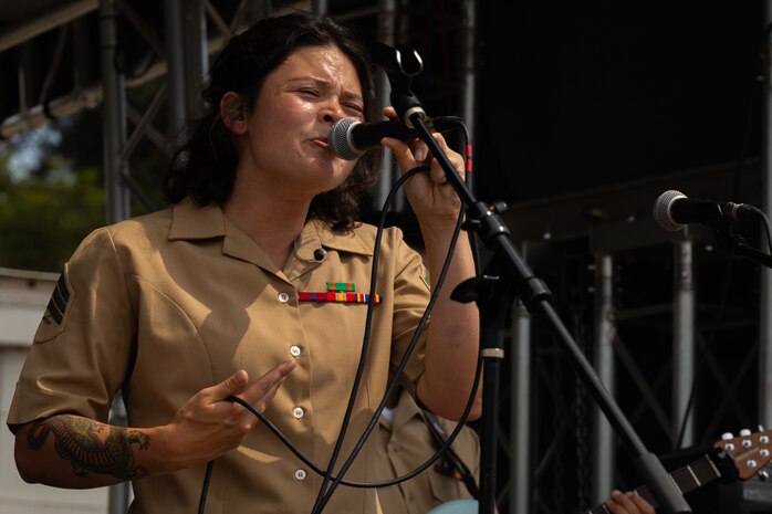 U.S. Marine Corps Sgt. Kassie Wagner, a vocalist with 1st Marine Division Band, gives a public performance as part of Seattle Seafair 2024 at Genesee Park in Seattle, Aug. 2, 2024. Seattle Seafair is the biggest summer celebration in the Pacific Northwest; spanning 10 weeks, featuring more than 40 events, and reaching more than two million people each year. (U.S. Marine Corps photo by Cpl. Bruin Largent)