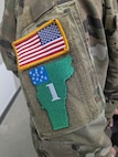 U.S. Army Sgt. Peter Fillion, C Troop, 2nd Squadron, 101st Cavalry Regiment, New York National Guard, displays his competitor patch after receiving the welcome brief for the Army National Guard Best Warrior finals.