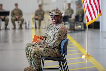 Incoming commander of 90th Troop Command, Oklahoma Army National Guard, Col. Steve D. Cheadle, listens to a speech given during a change of command ceremony held at the Army Aviation Support Facility in Lexington, Oklahoma, Aug. 4,  2024. The changing of command signifies the transfer of responsibility from outgoing commander Col. Robert W. Walker, to the incoming commander, Cheadle. (Oklahoma National Guard photo by Spc. Brooklyn Clark)