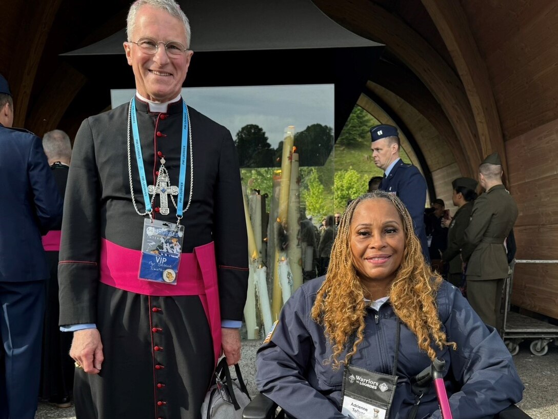 Archbishop of the military Timothy Broglio with Sgt. 1st Class Adrienne Toliver