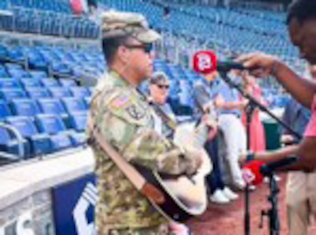 Staff Sgt Junel Custodio performs the National Anthem at the Washington Nationals Baseball Game