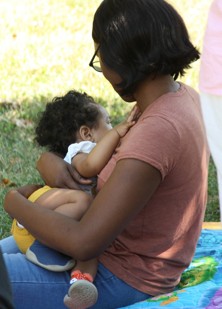 A mother breastfeeds her child at the 2023 Walter Reed Latch event. Walter Reed National Military Medical Center acknowledges National Breastfeeding Month during August as an opportunity to raise awareness about the benefits of breastfeeding for infants and parents.