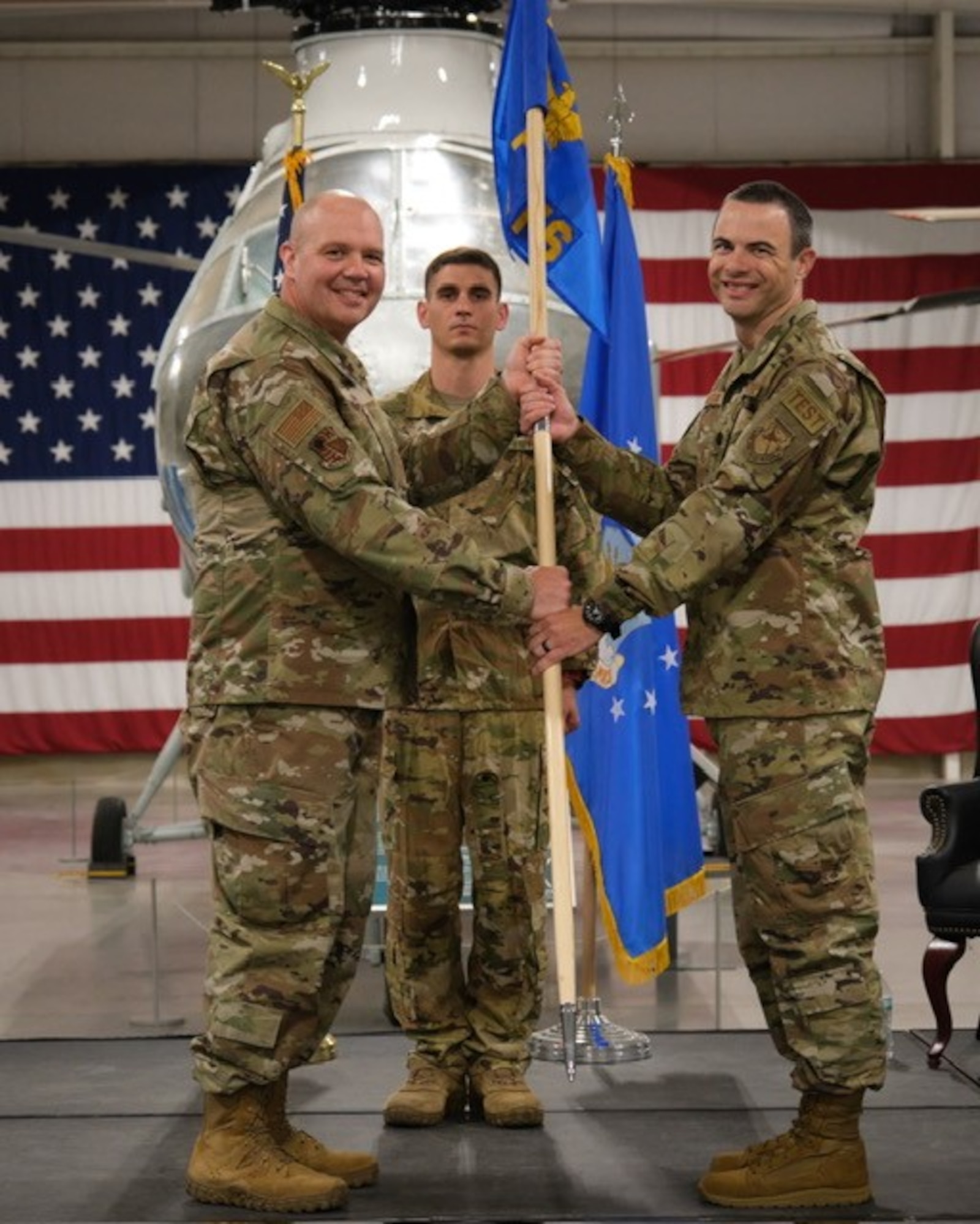 Lt. Col. Bryan Ralston, right, takes the guidon from Arnold Engineering Development Complex 804th Test Group Commander Col. Jason Vap, left, to assume command of the AEDC 719th Test Squadron during a Change of Command ceremony July 25, 2024, at Hill Air Force Base, Utah. (U.S. Air Force photo by Benito Gutierrez)