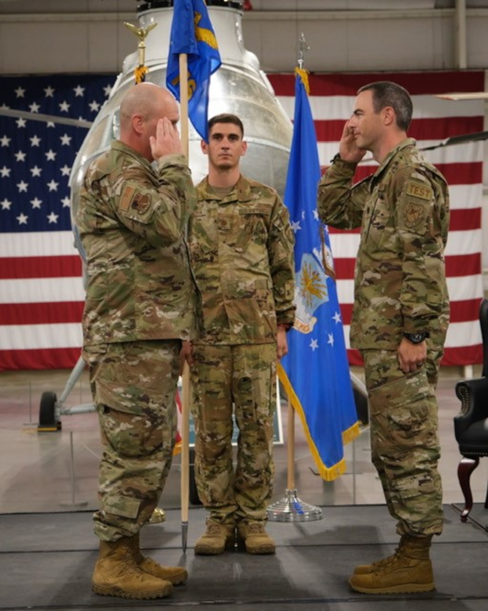 Lt. Col. Bryan Ralston, right, and Arnold Engineering Development Complex 804th Test Group Commander Col. Jason Vap, left, exchange salutes as Ralston prepares to take command of the AEDC 719th Test Squadron during a Change of Command ceremony July 25, 2024, at Hill Air Force Base, Utah. (U.S. Air Force photo by Benito Gutierrez)