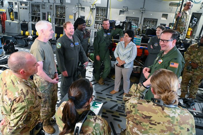 Col. Douglas Jeffrey, 433rd Airlift Wing commander, talks with 433rd Aeromedical Evacuation Squadron and 315th Airlift Wing Airmen ahead of an off-station training flight July 12, 2024 at Joint Base San Antonio-Lackland, Texas.