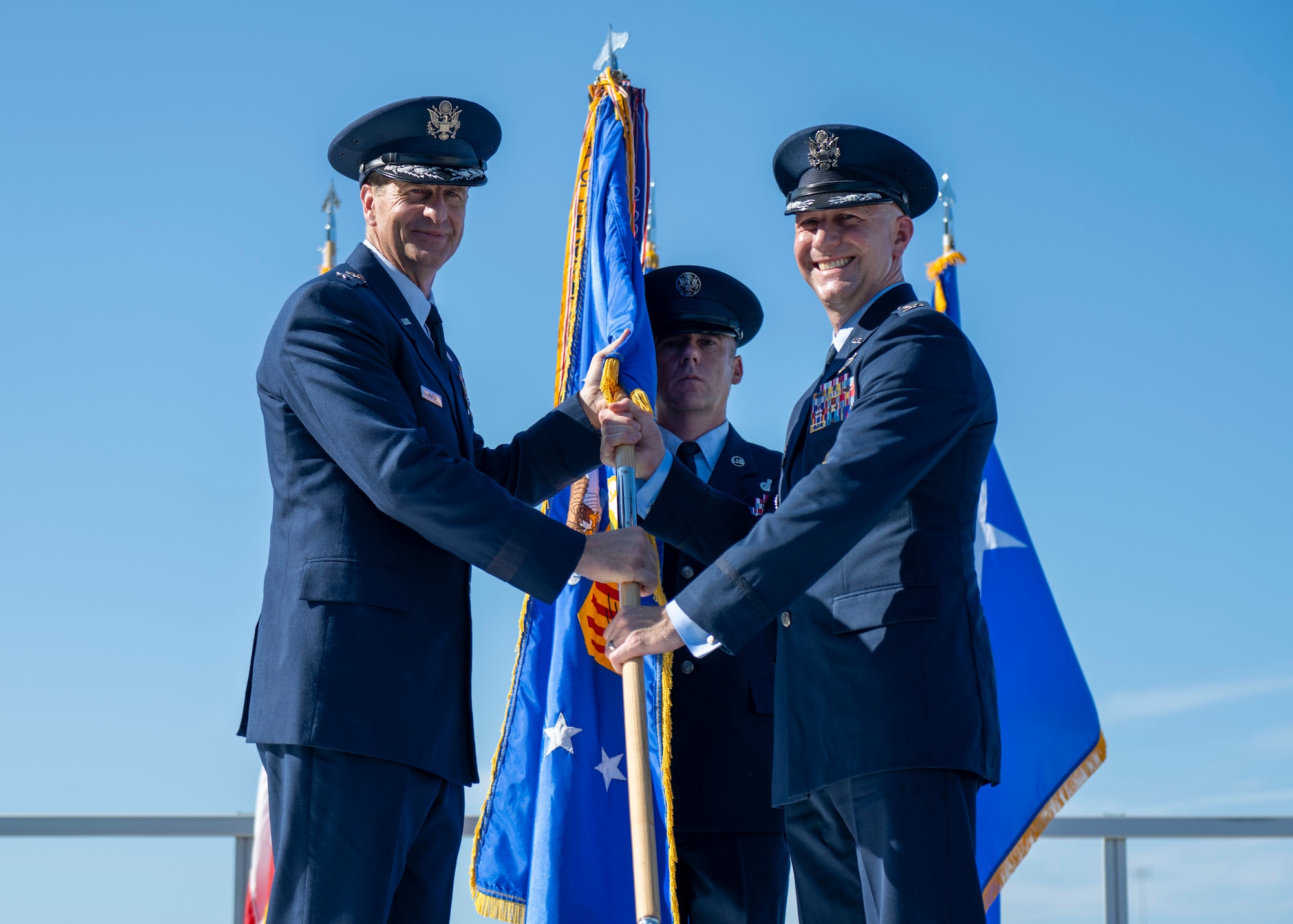 U.S. Air Force Maj. Gen. Corey Martin, 18th Air Force commander, passes the 6th Air Refueling Wing guidon to Col. Edward Szczepanik, 6th ARW commander, at MacDill Air Force Base, Florida, August 2, 2024.