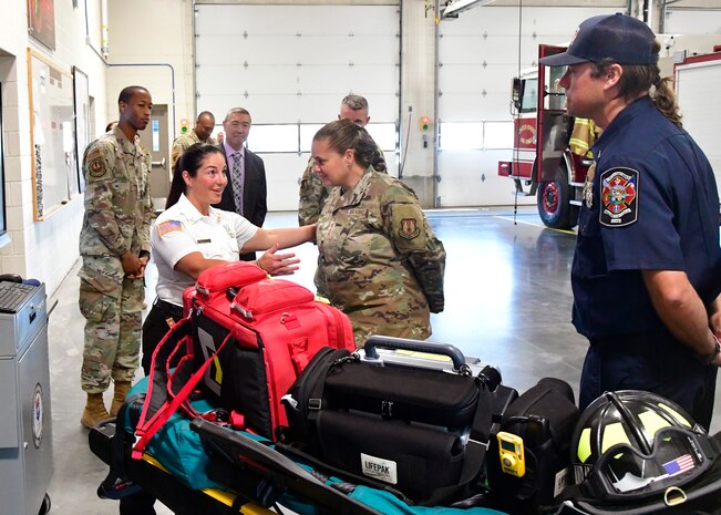 Left center, Tiana Bykowski, 775th Civil Engineering Squadron assistant fire prevention chief, introduces Lt. Gen. Linda S. Hurry, Air Force Materiel Command deputy commander, to Joshua Seigfried, 775th Civil Engineering Squadron paramedic, during the general’s immersion tour of Fire Station 1 at Hill Air Force Base, Utah, Aug. 2, 2024. In addition to visiting the 775th CES, Hurry received mission briefings from other AFMC mission partners including the Ogden Air Logistics Complex and Air Force Nuclear Weapons Center. (U. S. Air Force photo by Todd Cromar)