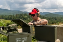 Staff Sgt. David Hacker, a combat arms instructor for the 109th Security Forces Squadron, prepares a firing position during a training exercise at the Ethan Allen training site in Jericho, Vermont, Aug. 1, 2024.