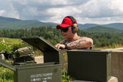 Staff Sgt. David Hacker, a combat arms instructor for the 109th Security Forces Squadron, prepares a firing position during a training exercise at the Ethan Allen training site in Jericho, Vermont, Aug. 1, 2024.