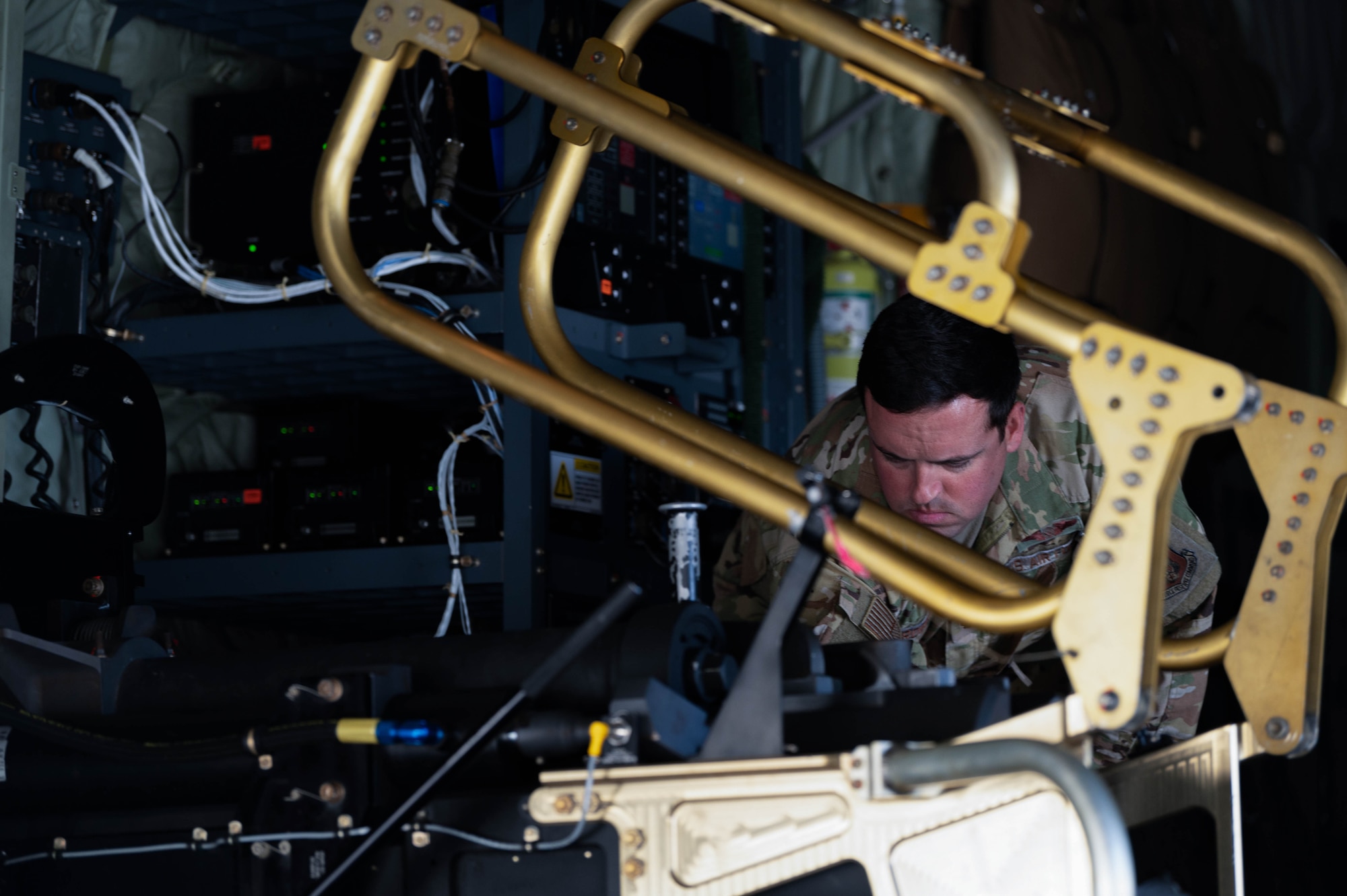 U.S. Air Force Tech Sgt. Thomas Crosby,  a 5th Special Operations Squadron special missions aviator, inspects the 105mm cannon on an AC-130J Ghostrider Gunship before live-fire training at Joint Base Elmendorf-Richardson, Alaska, July 17, 2024.