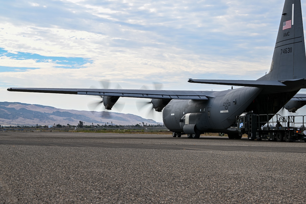 a photo of a c-130 unloading cargo