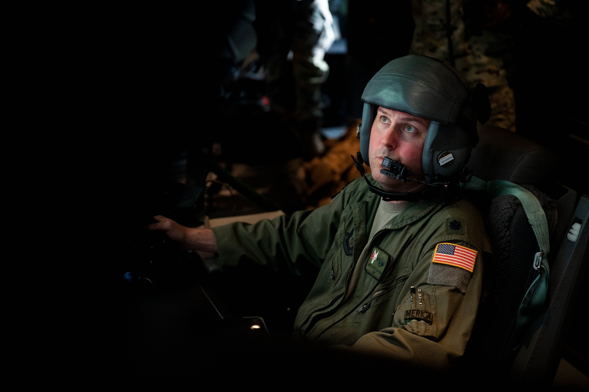 U.S. Air Force Lt. Col. Matthew Dempsey, a 5th Special Operations Squadron weapons system operator, participates in a live-fire training on board an AC-130J Ghostrider Gunship over Joint Base Elmendorf-Richardson, Alaska, July 19, 2024.