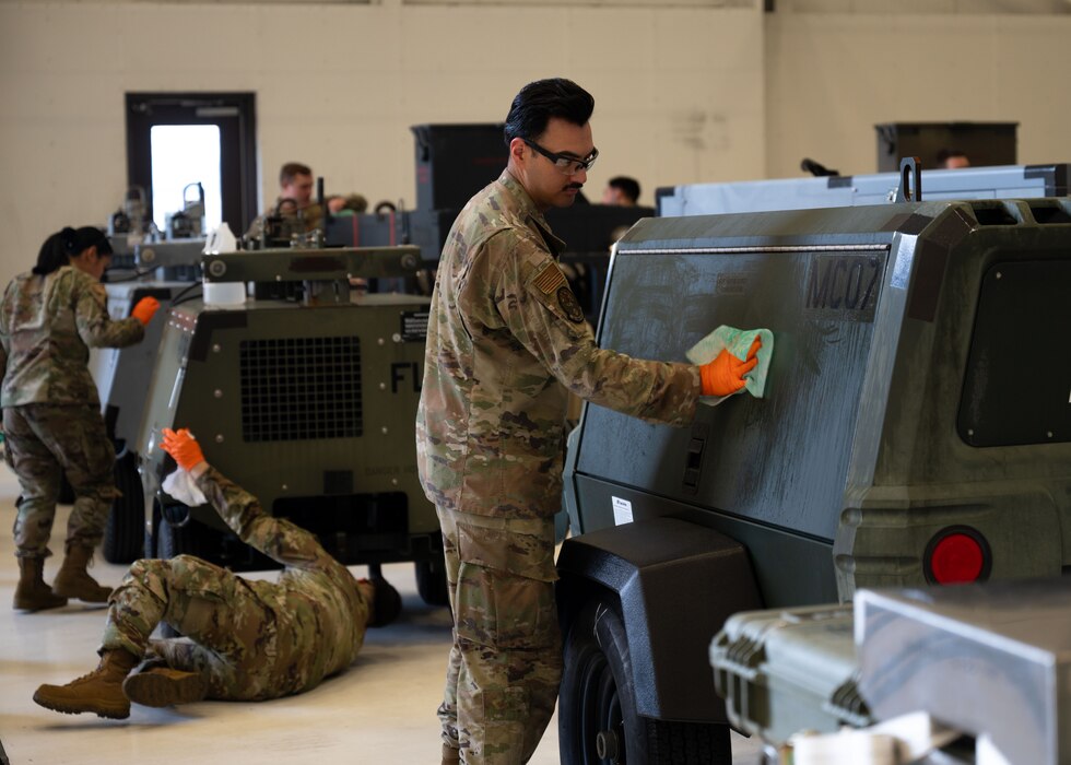 Team McChord Airmen clean and prepare equipment for a pre-Joint Inspection at Joint Base Lewis-McChord, Washington, August 2, 2024. The pre-JI is for an upcoming agile combat exercise, Operation KENNEY’S RETURN, and consisted of deep cleaning and preparing U.S. Air Force and Army cargo and equipment.