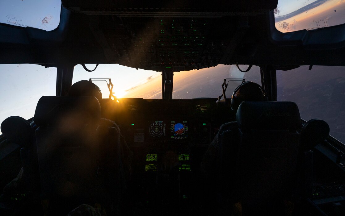 U.S. Air Force Capt. Angela Curtis, left, and Capt. Erica Joffre, pilots with the 4th Airlift Squadron, fly a C-17 Globemaster III during Operation Max Moose over the Pacific Northwest, July 11, 2023. Curtis and Joffre piloted the first leg of the mission, flying for 24-hours straight. The purpose of the exercise was to evaluate the 62d Airlift Wing ability to coordinate and launch a maximum number of aircraft in response to a simulated combat scenario, as well as to evaluate and identify gaps in various applicable emergency plans.