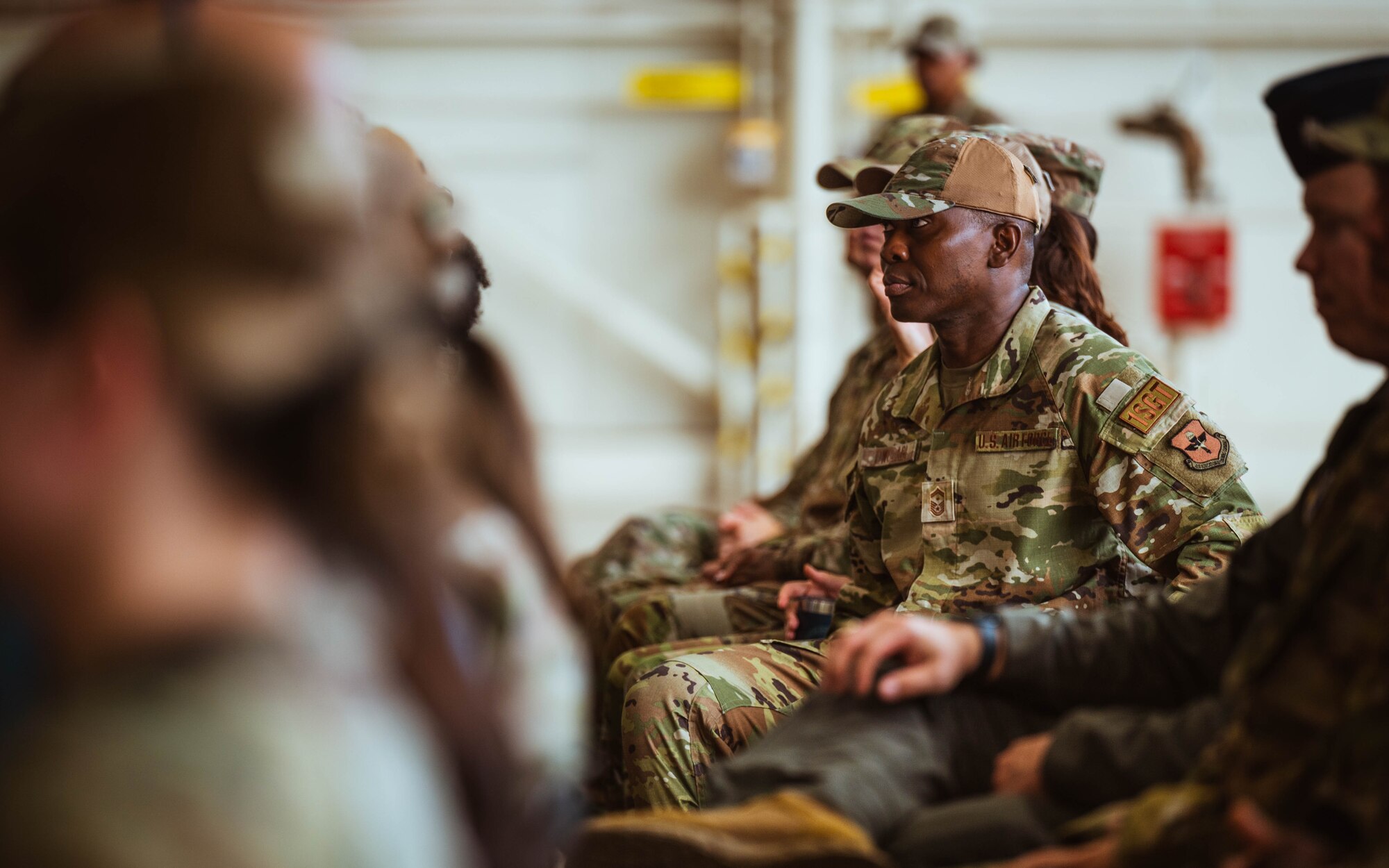 U.S. Air Force Senior Master Sgt. Olufemi Owolabi, 13th Combat Air Base Squadron first sergeant, watches the 13th CABS assumption of command ceremony, Aug. 5, 2024, at Luke Air Force Base, Arizona.