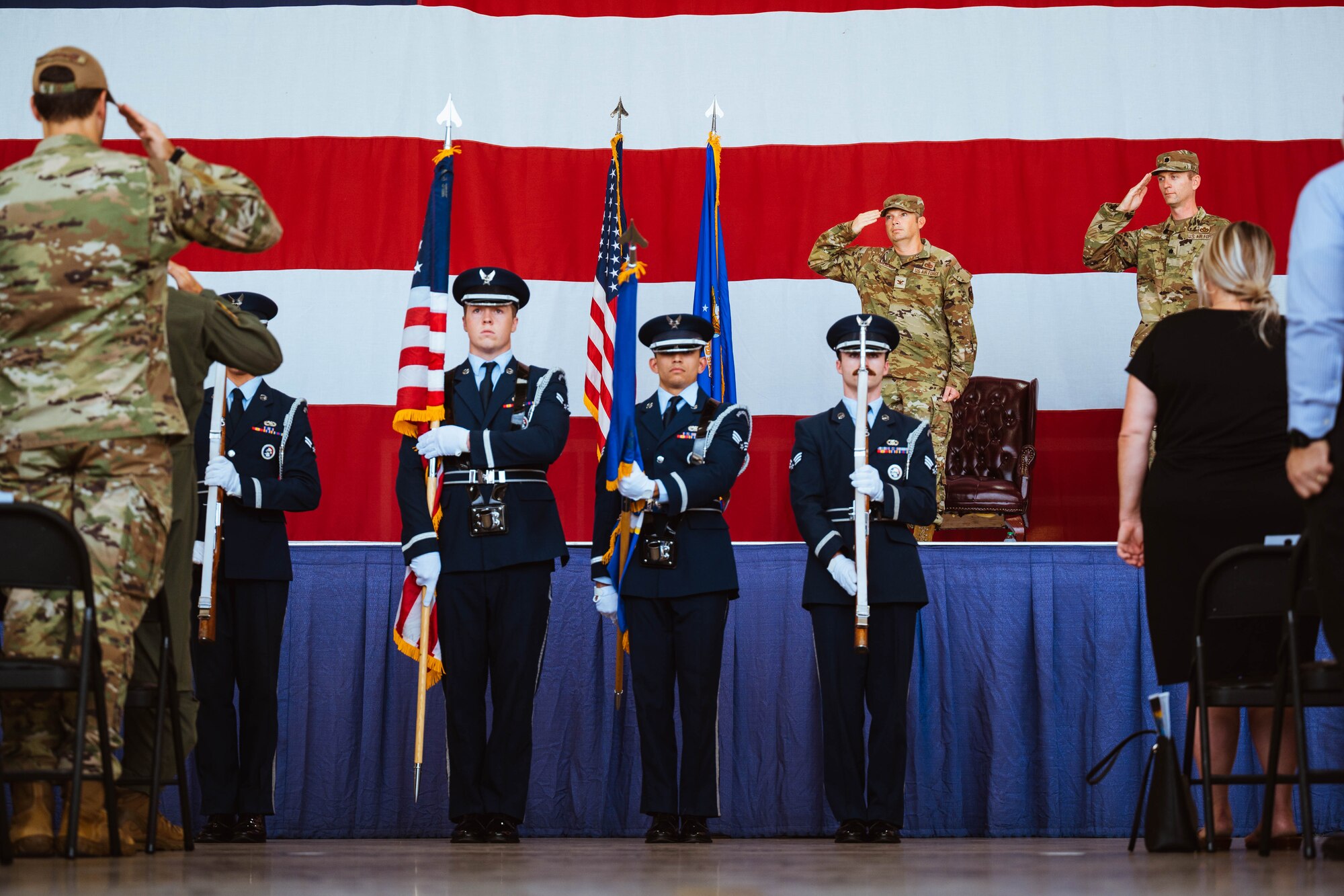 U.S. Air Force Honor Guardsmen assigned to the 56th Fighter Wing render a salute during the playing of the national anthem prior to the 13th Combat Air Base Squadron assumption of command, Aug. 5, 2024, at Luke Air Force Base, Arizona.