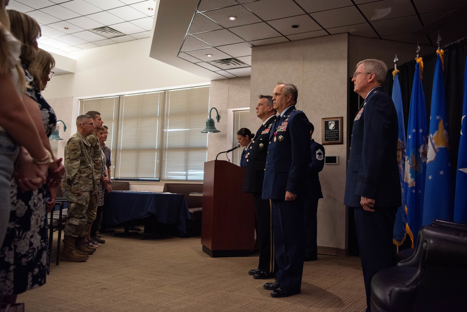 Members of the official party (right), stand at attention at the retirement ceremony for U.S. Air Force Brig. Gen. Rick L. Mutchler, Oklahoma National Guard Chief of Staff-Air, at Will Rogers Air National Guard Base, Oklahoma City, Aug. 3, 2024. Mutchler showcased his versatility and commitment to excellence throughout his career by serving in numerous roles, including 137th Special Operations Wing vice commander. (U.S. Air National Guard photo by Airman Kaedin Teel)