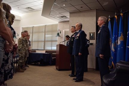 Members of the official party (right), stand at attention at the retirement ceremony for U.S. Air Force Brig. Gen. Rick L. Mutchler, Oklahoma National Guard Chief of Staff-Air, at Will Rogers Air National Guard Base, Oklahoma City, Aug. 3, 2024. Mutchler showcased his versatility and commitment to excellence throughout his career by serving in numerous roles, including 137th Special Operations Wing vice commander. (U.S. Air National Guard photo by Airman Kaedin Teel)