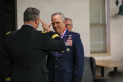 Brig. Gen. Rick L. Mutchler, former chief of staff for the Oklahoma Air National Guard, salutes Maj. Gen. Thomas Mancino, adjutant general for Oklahoma, during his retirement ceremony at Will Rogers Air National Guard Base, Oklahoma City, Aug. 3, 2024. Mutchler served in numerous critical roles, from his position as chief of supply at Will Rogers ANG Base to his most recent role as OKANG chief of staff, he consistently demonstrated exceptional leadership and dedication. (Oklahoma National Guard photo by Sgt. Connor McBride)