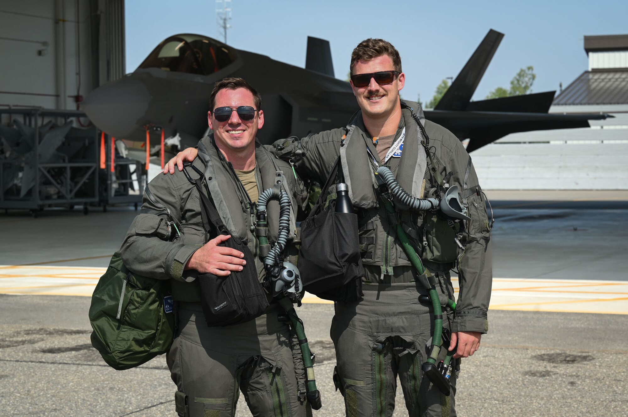 U.S. Air Force Capt. Zachary Lietzau, 58th Fighter Squadron F-35A Lightning II Basic-Course pilot, left, and Capt. Zachary Wolf, 58th Fighter Squadron F-35A Lightning II Basic-Course pilot, right, work on their training syllabus capstones at Eielson Air Force Base, Alaska, July 25, 2024.