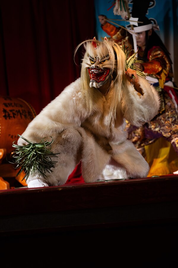 Members of the Hiroshima City-based Kagura Dance group perform a traditional dance at Marine Corps Air Station Iwakuni, Japan, July 15, 2024. The Kagura group performed a traditional samurai-themed Japanese dance to provide an engaging and interactive event that demonstrates Japanese culture and history for families at MCAS Iwakuni. (U.S. Marine Corps photo by Cpl. Isaac Orozco)