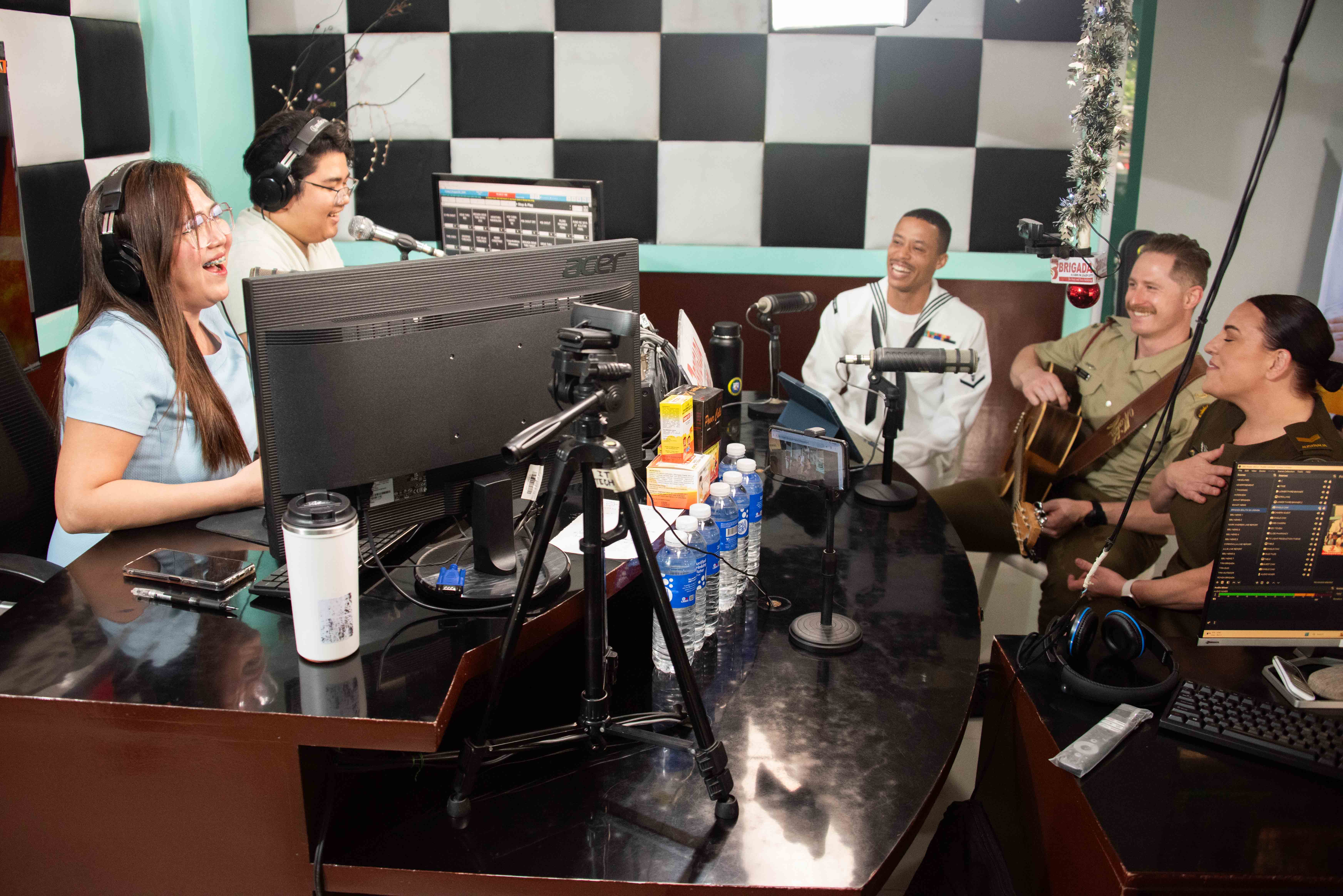LEGAZPI, Philippines (Aug. 2, 2024) – DJ’s Mia & Marvs host members of the Pacific Fleet band during a live radio show at the 91.5 Brigada News FM Lagazpi radio station in support of Pacific Partnership 24-2 in Legazpi, Philippines, Aug. 2, 2024. Now in its 20th iteration, the Pacific Partnership series is the largest annual multinational humanitarian assistance and disaster relief preparedness mission conducted in the Indo-Pacific. Pacific Partnership works collaboratively with host and partner nations to enhance regional interoperability and disaster response capabilities, increase security and stability in the region, and foster new and enduring friendships in the Indo-Pacific. (U.S. Navy photo by Chief Mass Communication Specialist Raymond D. Diaz III/Released)
