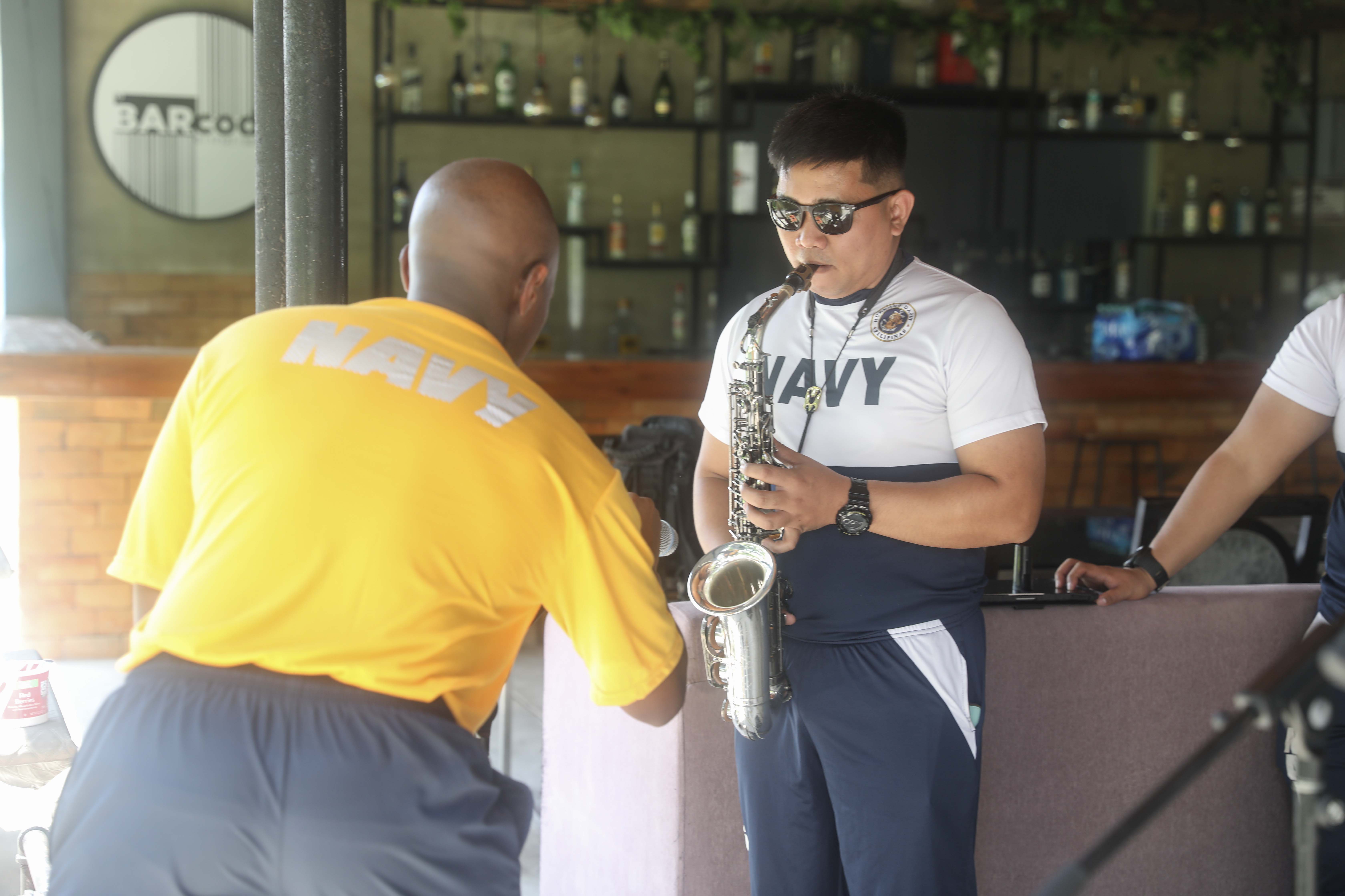 LEGAZPI, Philippines (Aug. 3, 2024) – Philippine Navy Musician Seaman 1st Class Joseph Palana, with the Philippine Navy Seabees Band, conducts a sound check while U.S. Navy Musician 2nd Class Micah Lewis of Memphis, Tenn., drummer and band leader of the Pacific Partnership Band, adjusts his microphone during a subject matter expert exchange with the Seabees Band in Legazpi, Philippines, Aug. 3, 2024. The subject matter expert exchange was used to integrate the Seabees band with the Pacific Partnership 24-2 band in order to play several shows together throughout Legazpi. Now in its 20th iteration, the Pacific Partnership series is the largest annual multinational humanitarian assistance and disaster relief preparedness mission conducted in the Indo-Pacific. Pacific Partnership works collaboratively with host and partner nations to enhance regional interoperability and disaster response capabilities, increase security and stability in the region, and foster new and enduring friendships in the Indo-Pacific. (U.S. Navy photo by Mass Communication Specialist 1st Class Ryan D. McLearnon/Released)