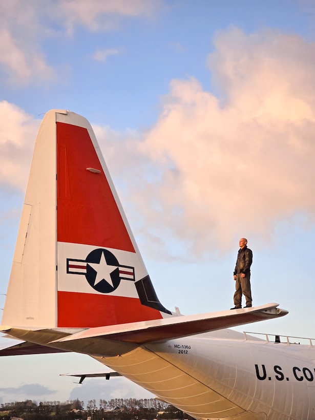 U.S. Coast Guard Petty Officer 2nd Class Nicholas Martino, an Aviation Maintenance Technician at U.S. Coast Guard Air Station Barbers Point, stands on the right horizontal stabilizer of a Coast Guard Air Station Barbers Point HC-130 Super Hercules on the ramp of the Royal New Zealand Air Force Base in Auckland, New Zealand, July 12, 2024. The U.S. Coast Guard completed participation in Operation Nasse, a three-month operation conducted by Australia, France, New Zealand, and the U.S. to safeguard the invaluable marine resources of Pacific Island nations and the Western Central Pacific Ocean (U.S. Coast Guard photo by Petty Officer 2nd Class Jean Collado)