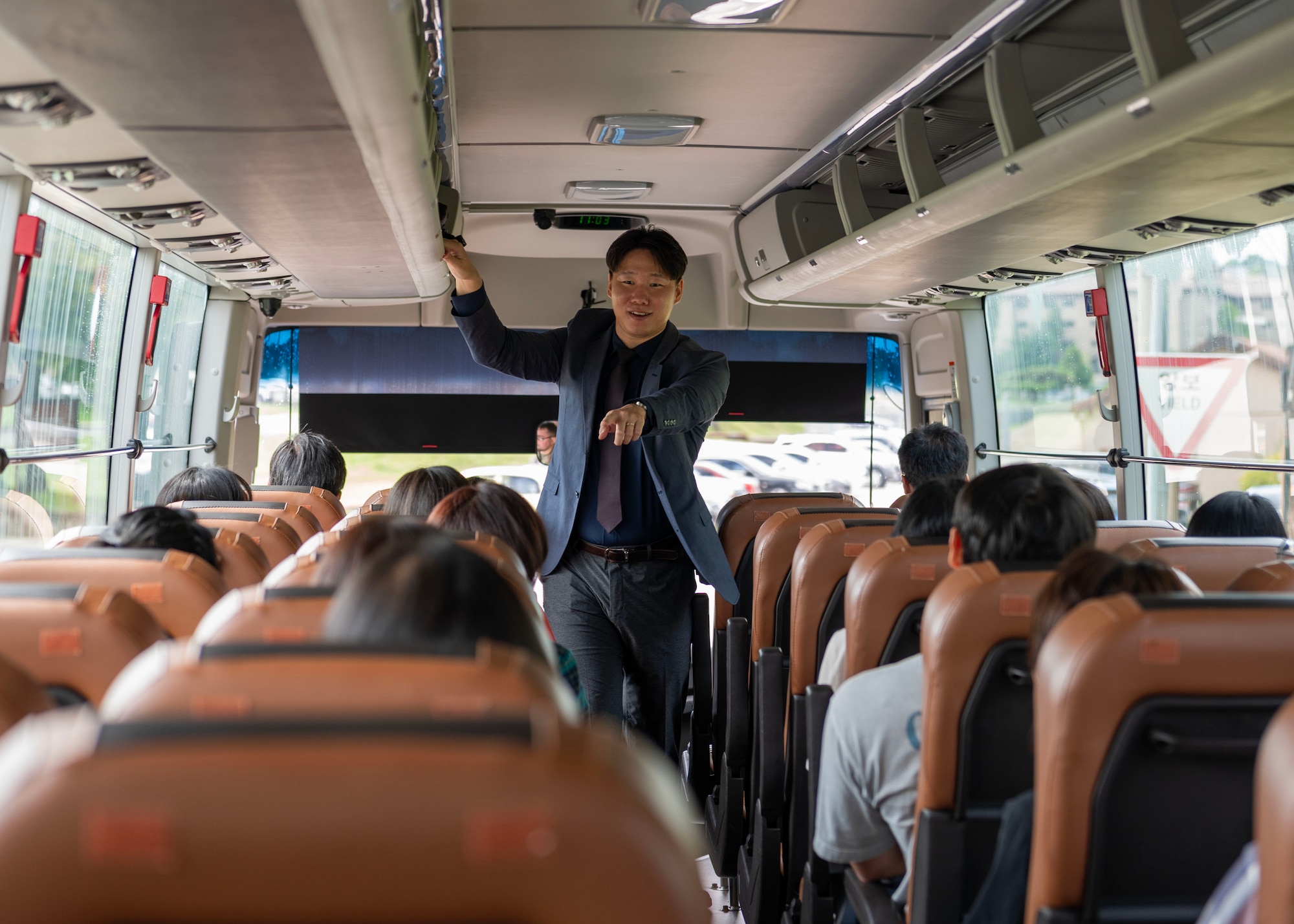 Dae Hwan Kim, 51st Fighter Wing Public Affairs specialist, hosts a base tour for members from the Pyeongtaek International Exchange Foundation at Osan Air Base, Republic of Korea, Aug. 6, 2024. The tour highlighted the base’s history, from its origins on land previously occupied by villages, to its current role as a forward-deployed installation that provides various air combat and support functions. It covered recent expansions such as new housing towers, the recently opened chapel and other enhancements across the installation. (U.S. Air Force photo by Staff Sgt. Aubree Owens)