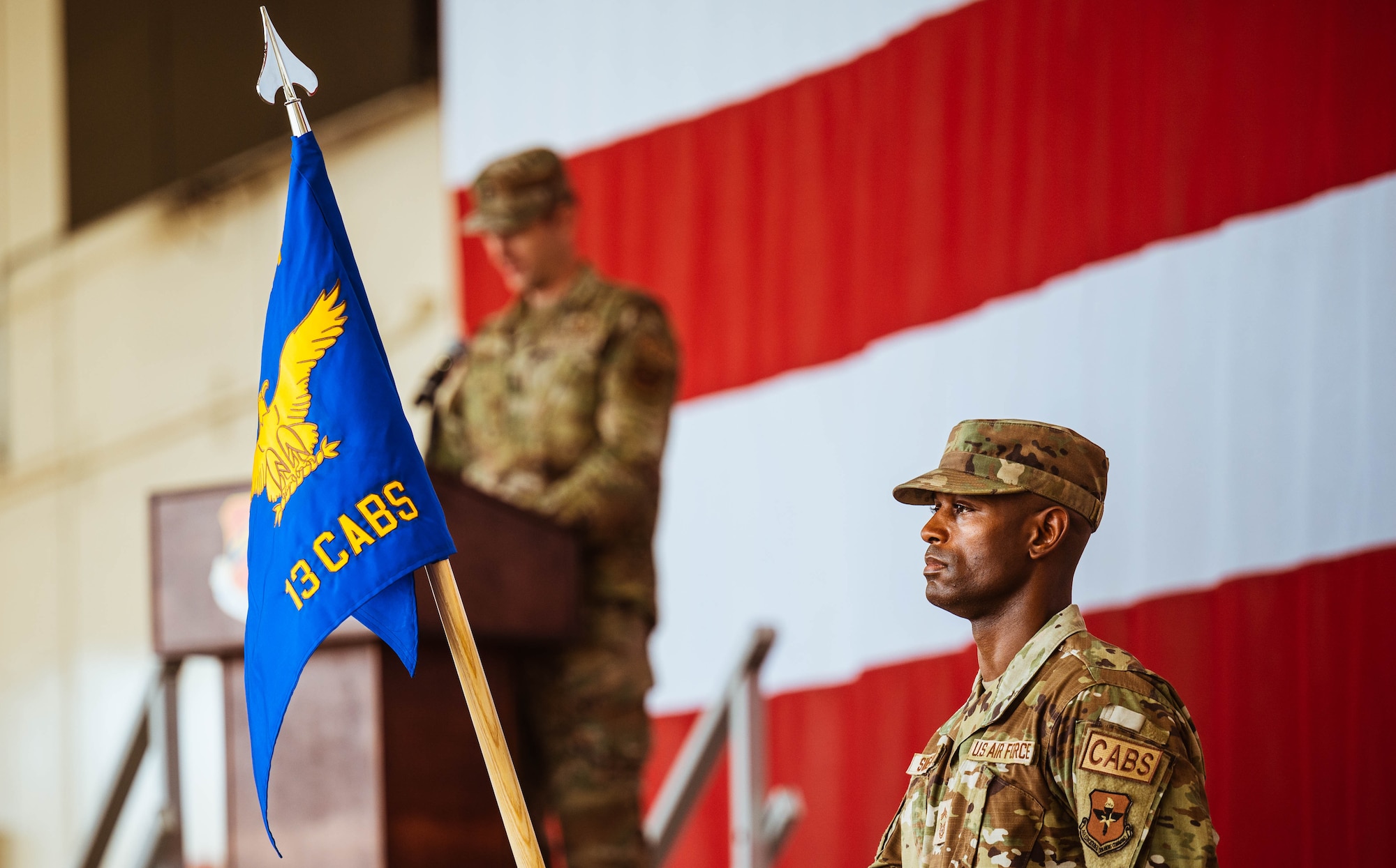 U.S. Air Force Chief Master Sgt. Leray Smedley, 13th Combat Air Base Squadron senior enlisted leader, holds the guidon during the 13th CABS assumption of command ceremony, Aug. 5, 2024, at Luke Air Force Base, Arizona.