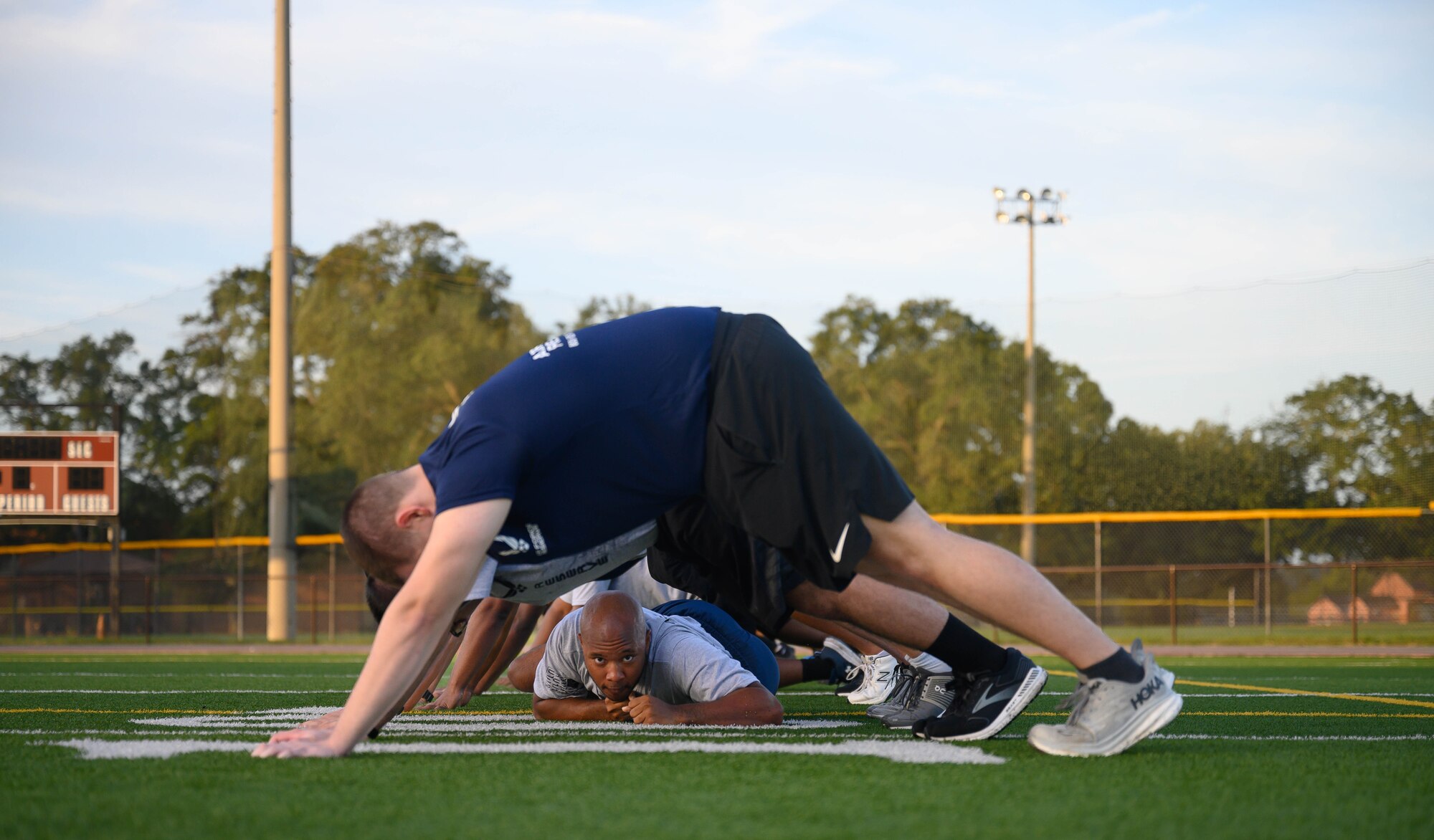 Development and Training Flight trainees assigned to the 315th Airlift Wing, Joint Base Charleston, S.C. and 908th Flying Training Wing, Maxwell Air Force Base, Ala., perform physical training exercises during their unit training assembly immersion tour of Air Force Reserve Command, Robins Air Force Base, Ga. Sunday, Aug. 4, 2024.