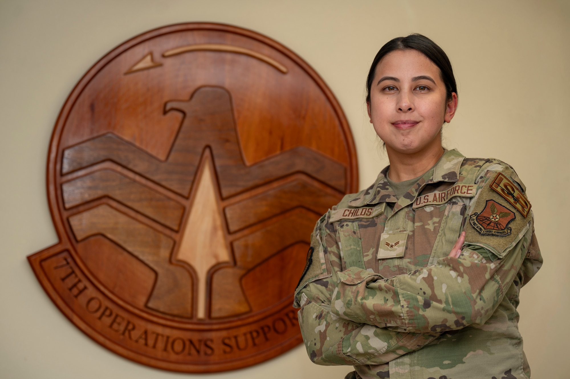U.S. Air Force Airman 1st Class Brieanne Childs, 7th Operations Support Squadron all source intelligence analyst, poses for a photo at Dyess Air Force Base, Texas, July 1, 2024. Childs sorts through and analyzes information relating to adversaries then creates briefs to keep base leadership informed. (U.S. Air Force photo by Airman 1st Class Emma Anderson)