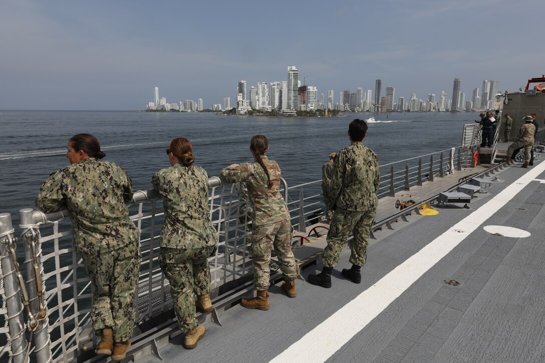 Sailors and Soldiers, assigned to Spearhead-class expeditionary fast transport ship USNS Burlington (T-EPF 10), watch as the ship arrives in Cartagena, Colombia as part of Continuing Promise 2024.