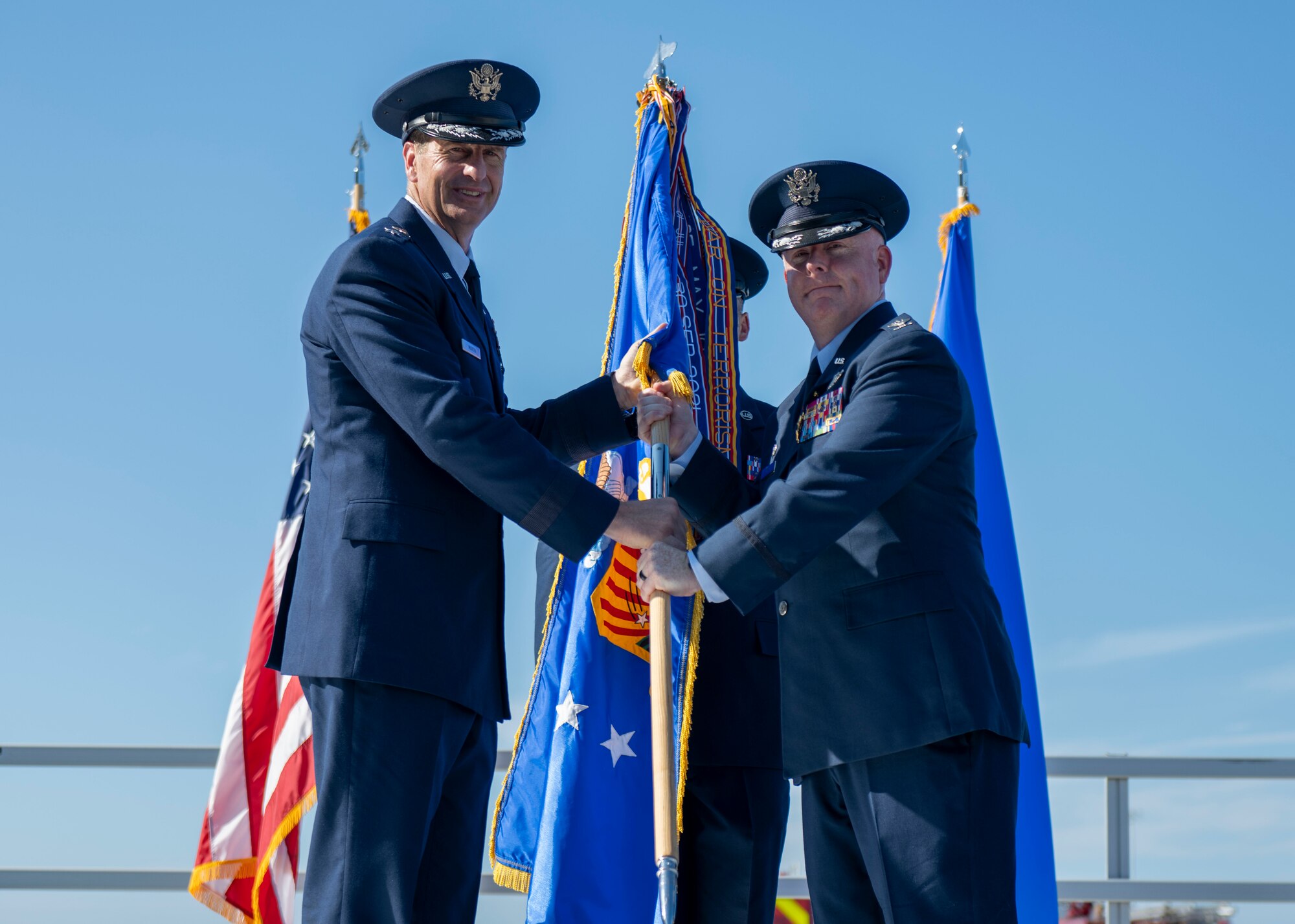 U.S. Air Force Maj. Gen. Corey Martin, 18th Air Force commander,  takes the 6th Air Refueling Wing guidon from Col. Adam Bingham, outgoing 6th Air Refueling Wing commander during a change of command ceremony at MacDill Air Force Base, Florida, August 2, 2024.