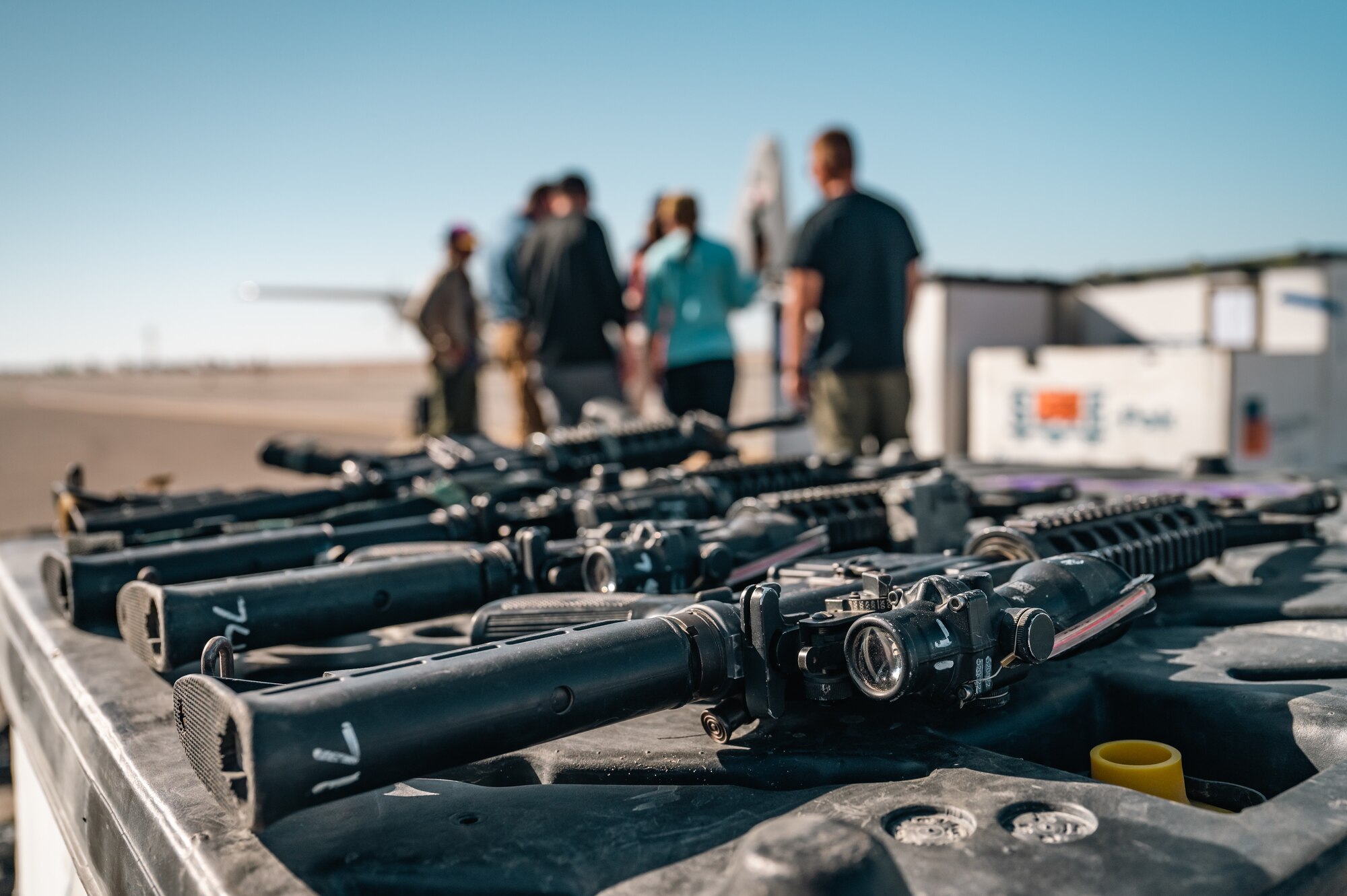 Aerial porters from the 387th Air Expeditionary Squadron’s Quick Reaction Team compare serial numbers of weapons.
