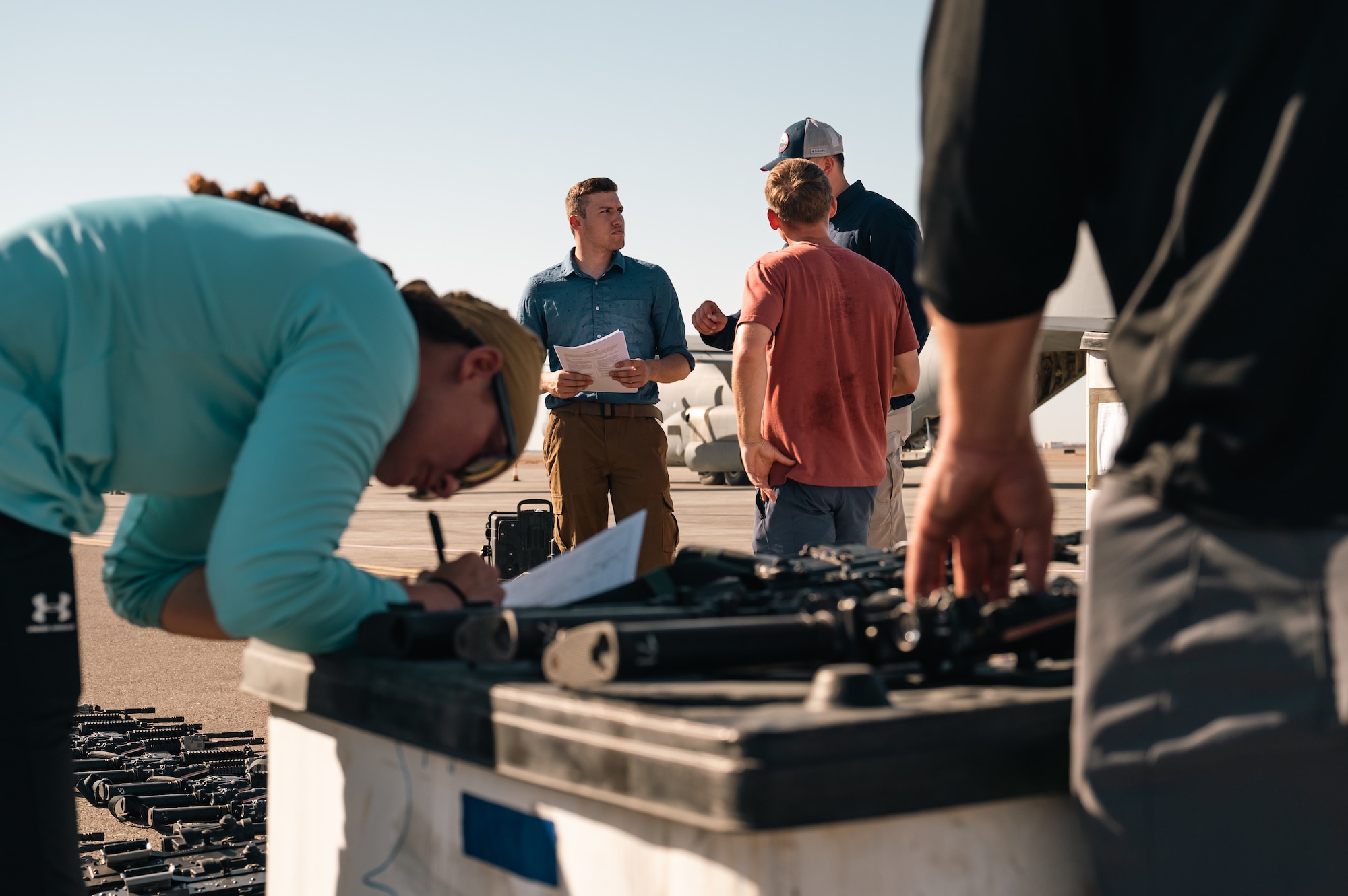 Aerial porters from the 387th Air Expeditionary Squadron’s Quick Reaction Team discuss operations