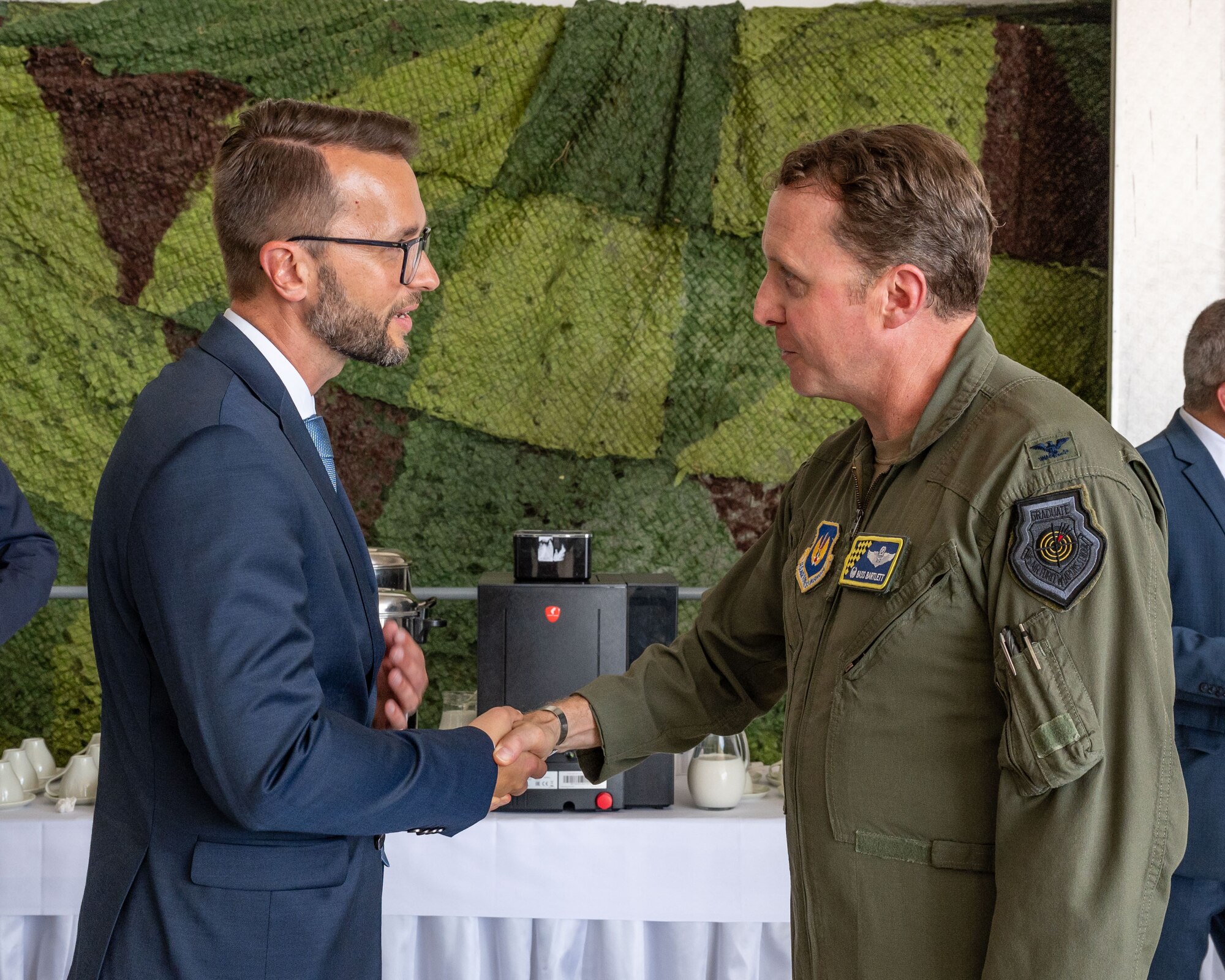 U.S. Air Force Col. Matthew Bartlett, 435th Air Ground Operation Wing commander, right, speaks with Martin Vojtašovič, Ministry of Defence of the Slovak Republic state secretary following a handover ceremony at Malacky Air Base, Slovakia, July 10, 2024. During the ceremony, Bartlett reflected on his appreciation for the U.S. and Slovak friendship and the nations shared commitment to peace and security around the world. (U.S. Air Force photo by Airman 1st Class Eve Daugherty)