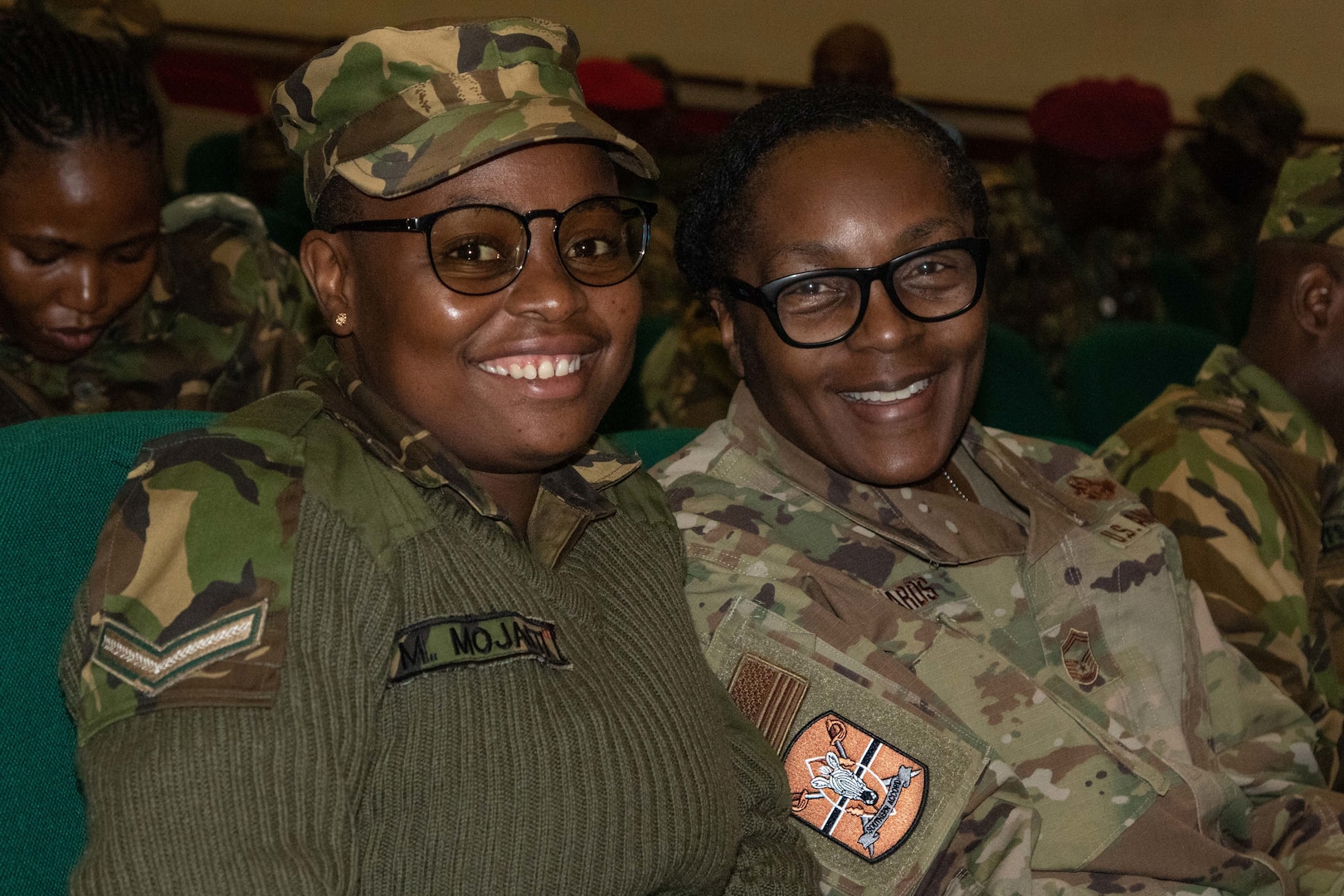 Botswana Defence Force Lance Cpl. Malebogo Mojaeti, an aircraft mechanic, and U.S. Air Force Senior Master Sgt. Jerri Edwards, bilateral affairs noncommissioned officer at U.S. Embassy Gaborone, during the opening ceremony of exercise Southern Accord 2024 in Gaborone, Botswana, Aug. 5, 2024. The biannual joint exercise is sponsored by U.S. Africa Command and led by U.S. Army Southern European Task Force, Africa.